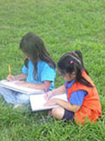 Children drawing outside